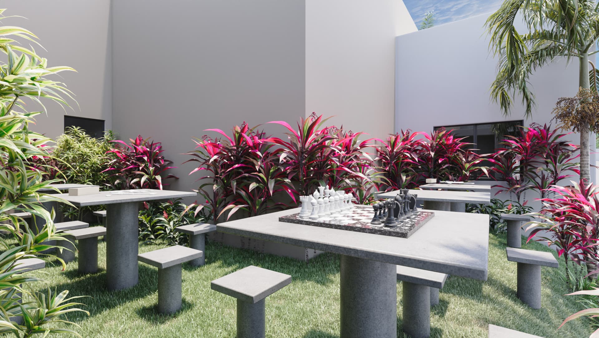 Praça dos jogos do Uni com mesas de xadrez em concreto e paisagismo
